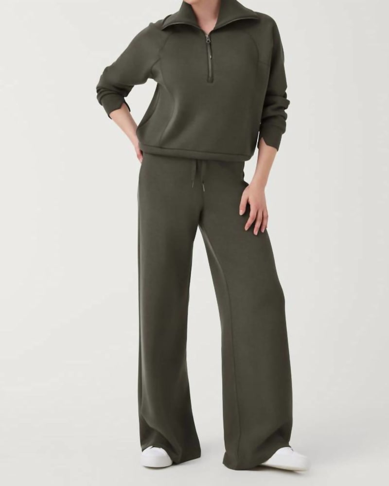 Front of a model wearing a size L Airessentials Wide Leg Pants in Dark Palm in Dark Palm by Spanx. | dia_product_style_image_id:332195